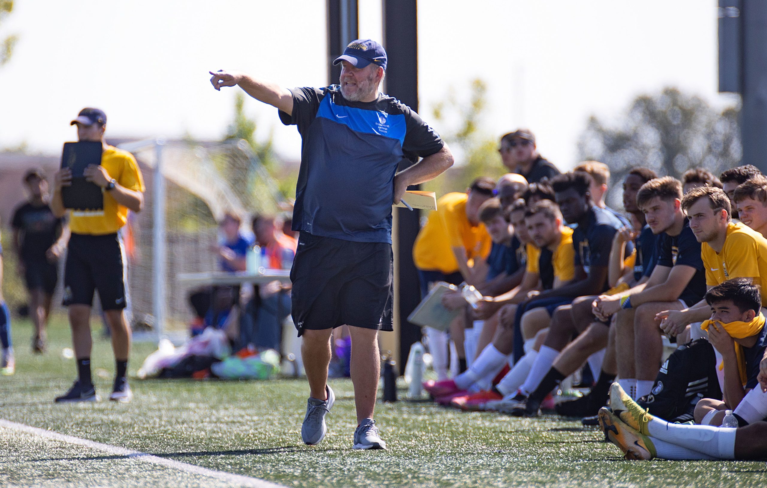 coach communicating from soccer sideline
