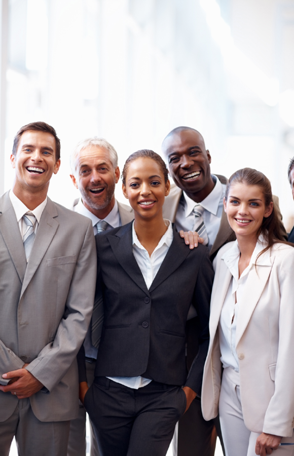 a group of professionals smiling at the camera