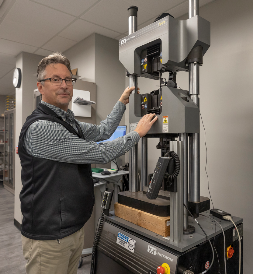 Dennis Fohey operating a machine