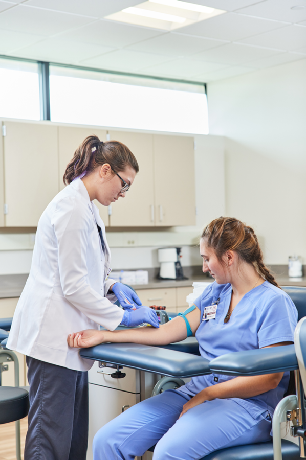 doctor reading a patient's arm