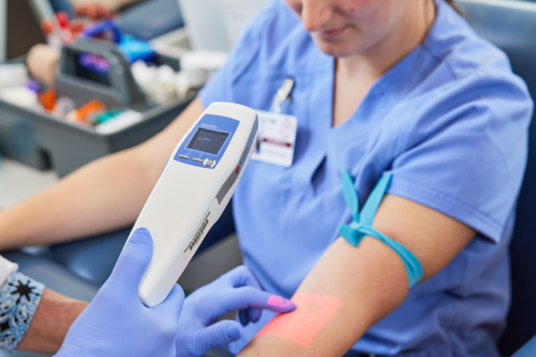 doctor scanning patient arm
