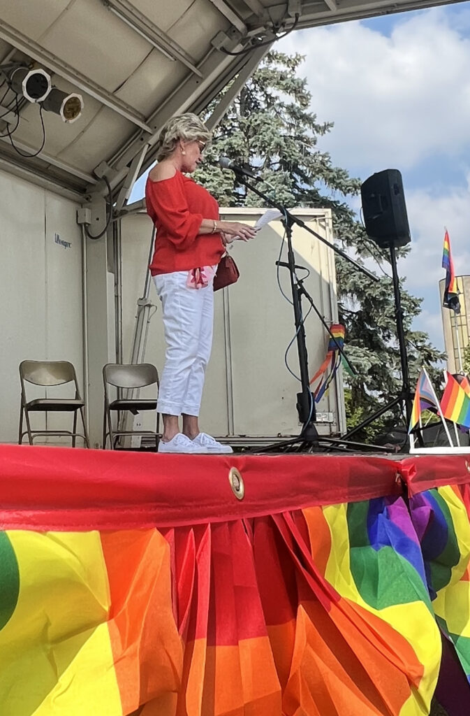 person speaking at microphone