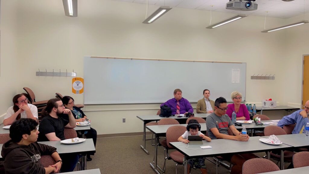 people listening to speaker in a classroom