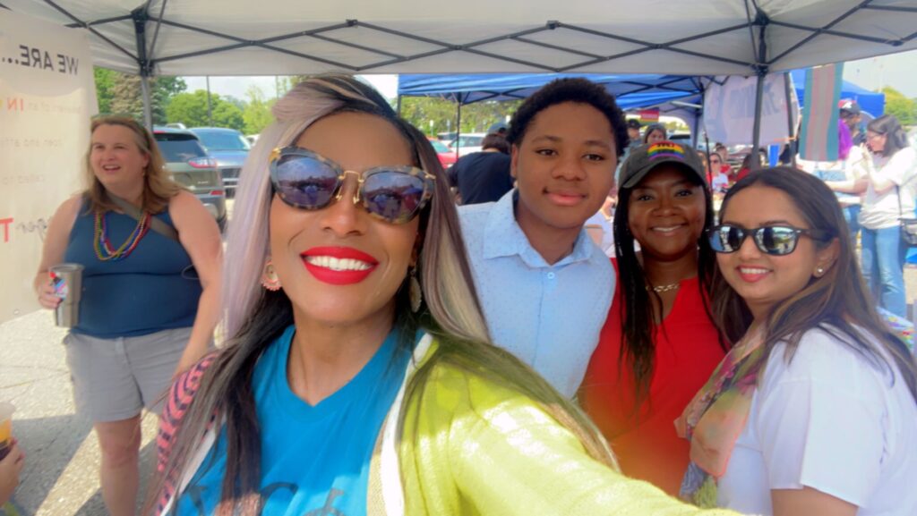 group smiling in selfie photo