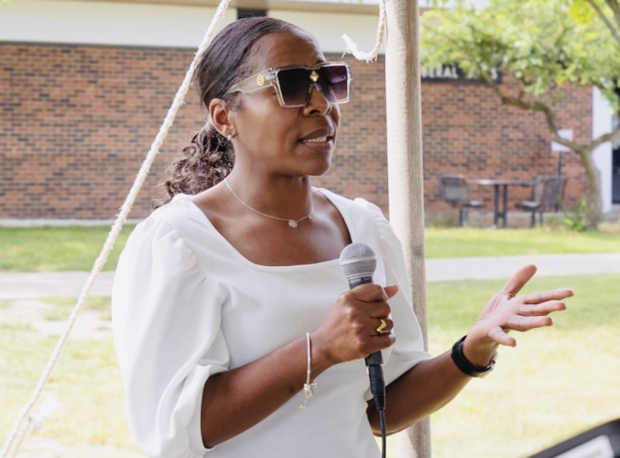 person speaking in microphone
