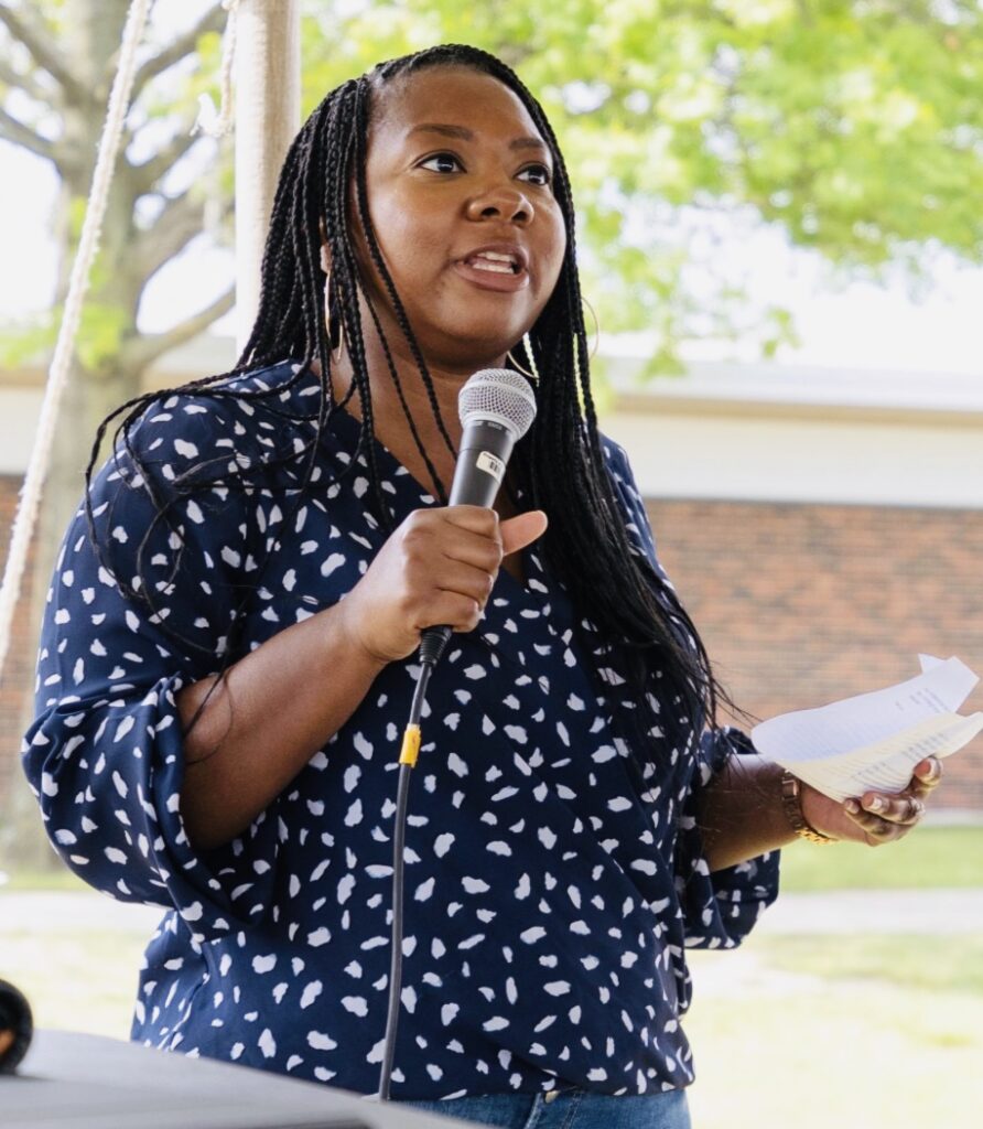 person speaking in microphone