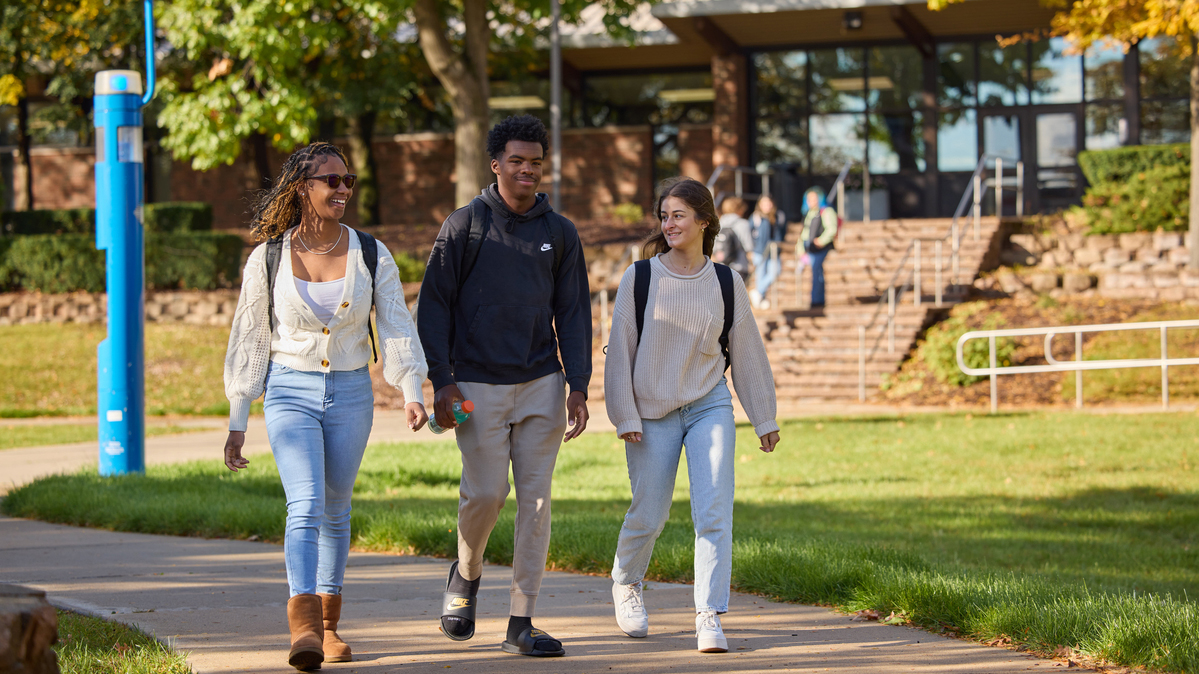 students walking outdoors fall campus