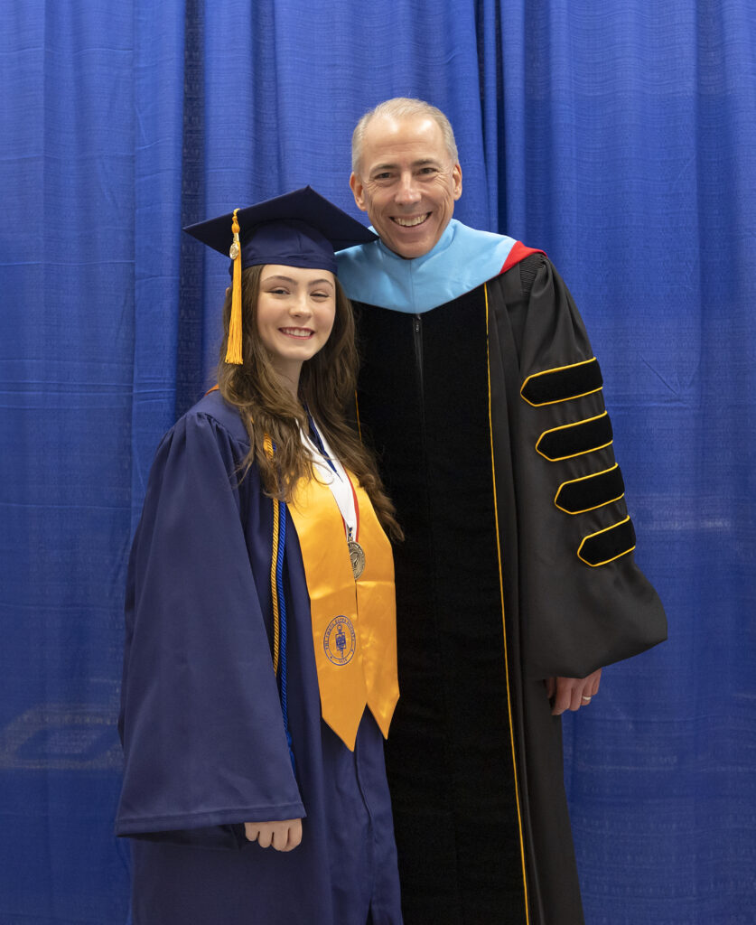 The College President with student in regalia