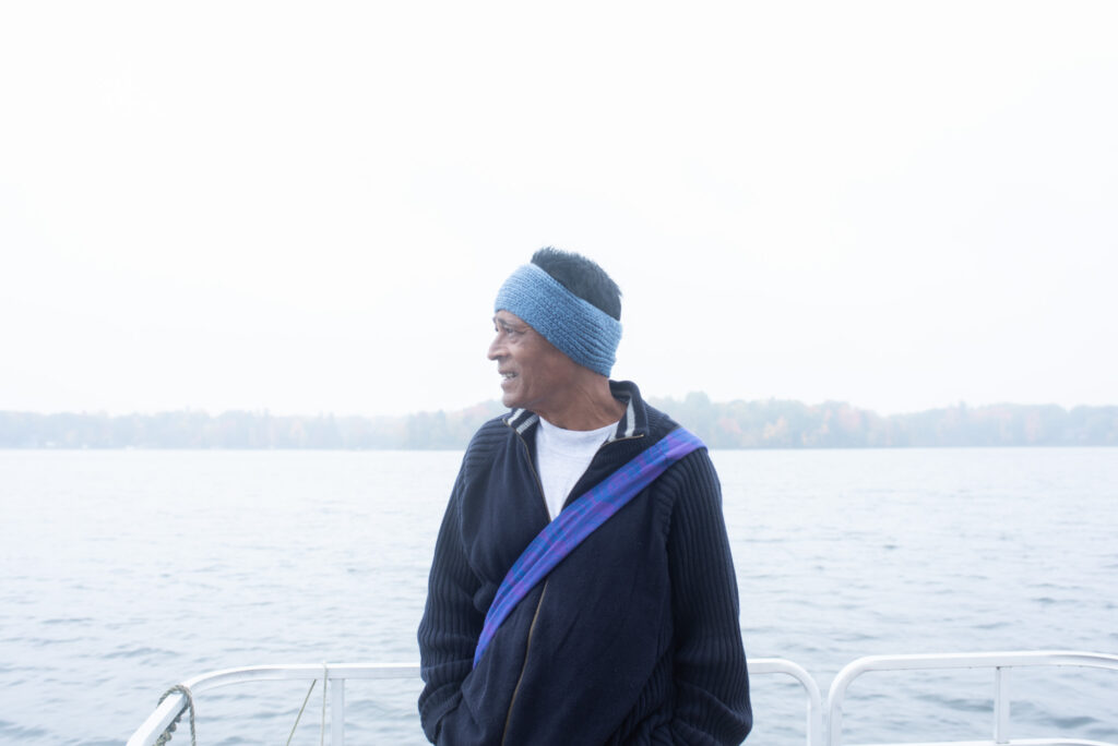 person standing by bay of water