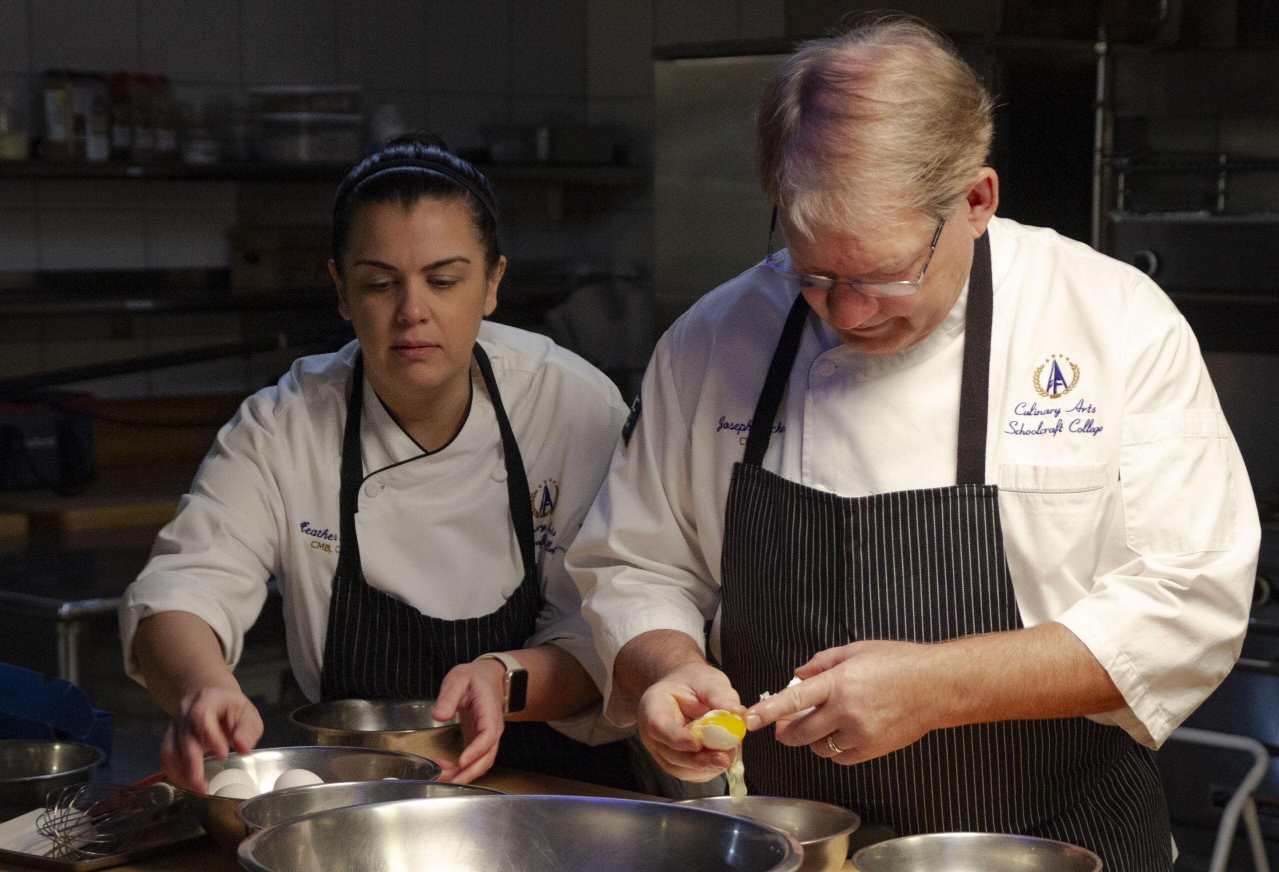 two chefs baking with eggs