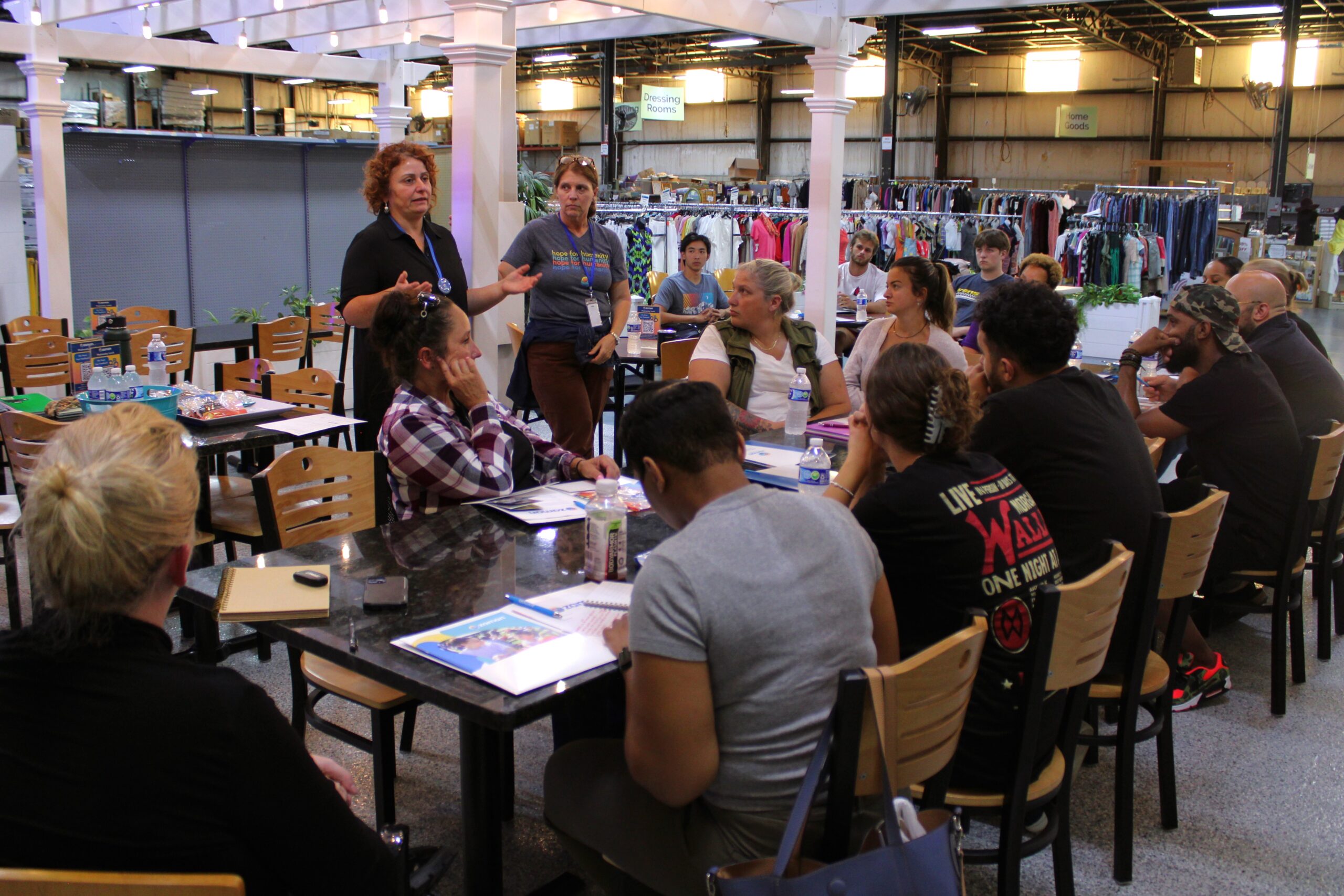 group of people conversing in restaurant setting