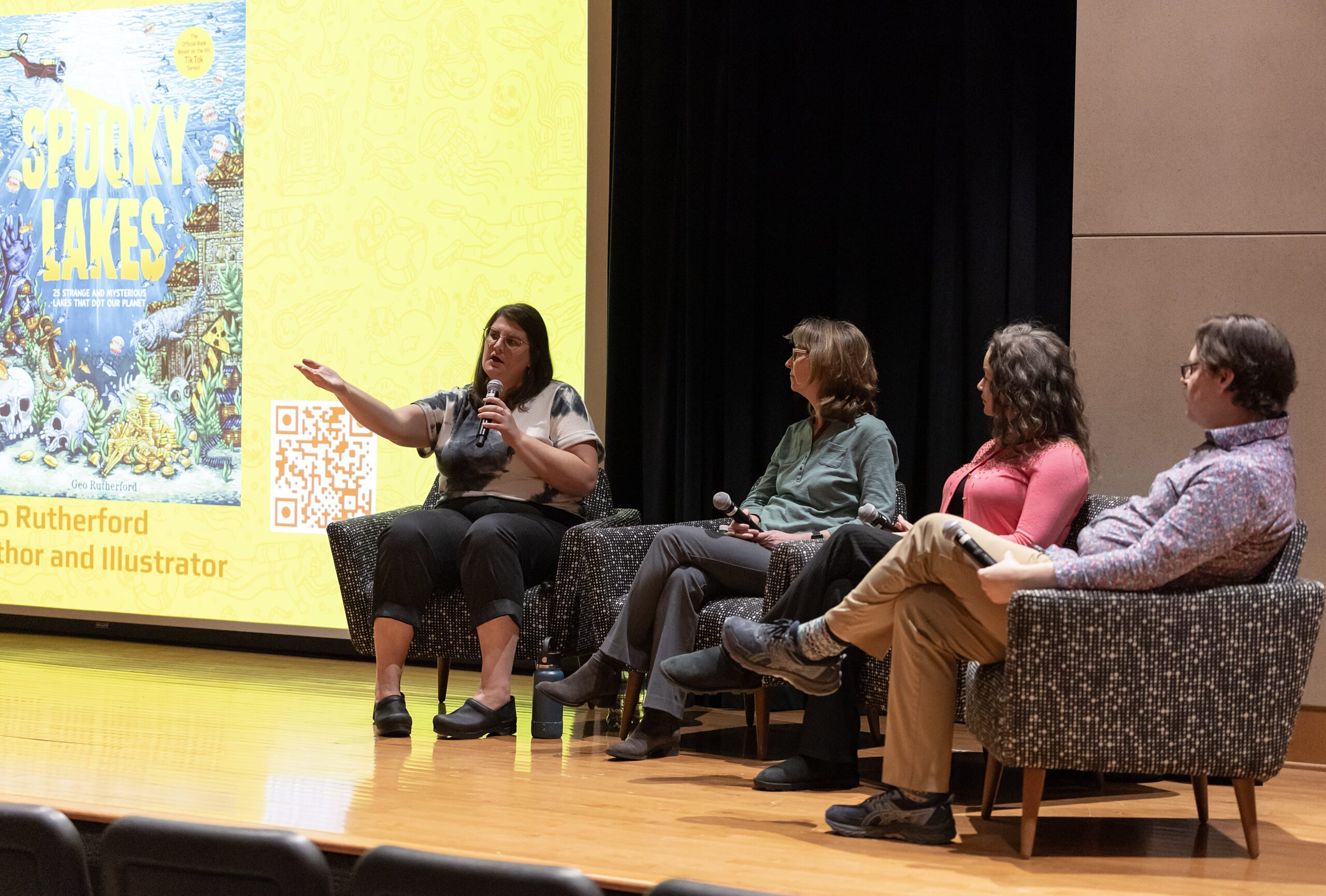 panel speaking on stage