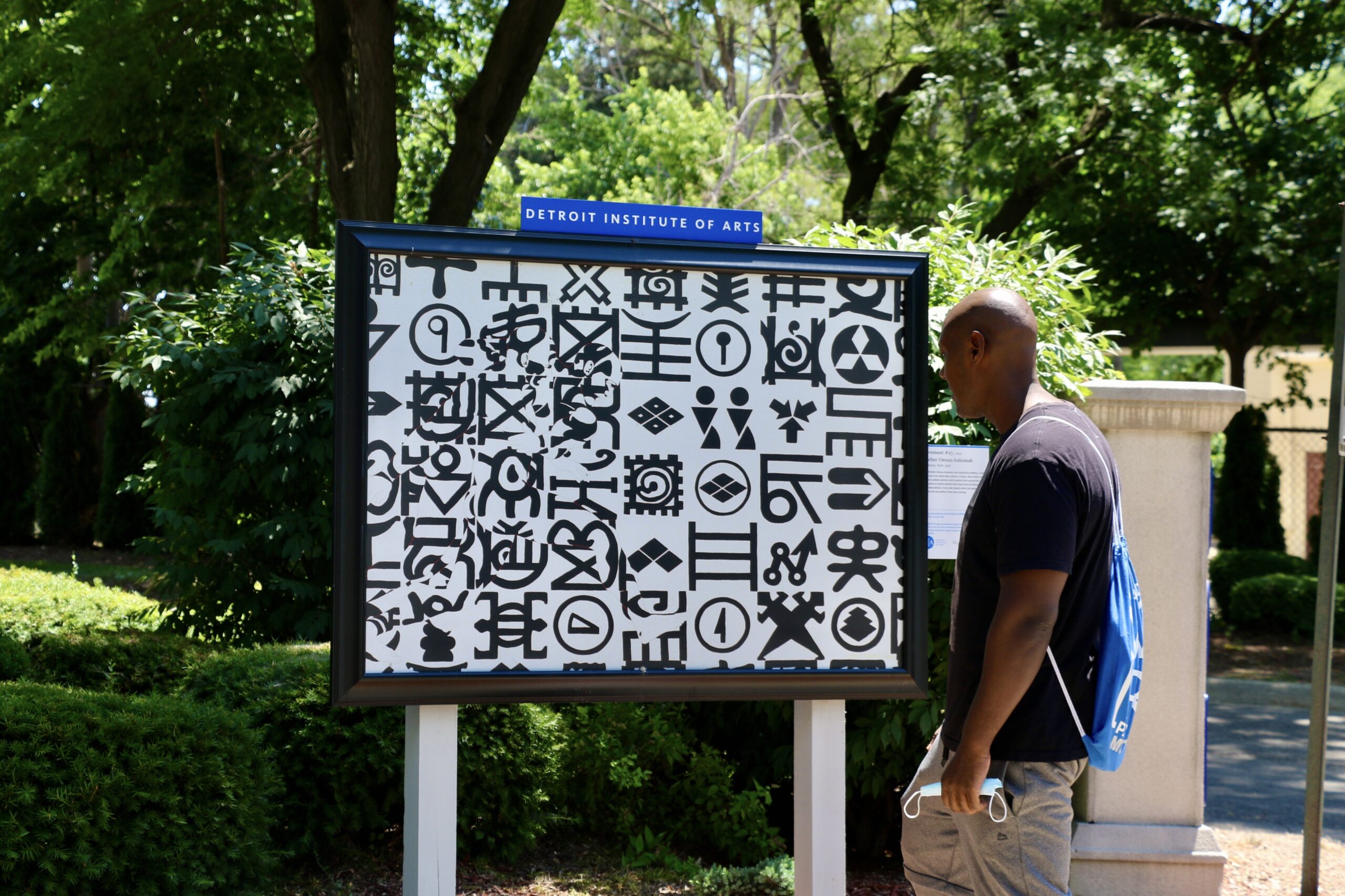person viewing outdoor artwork