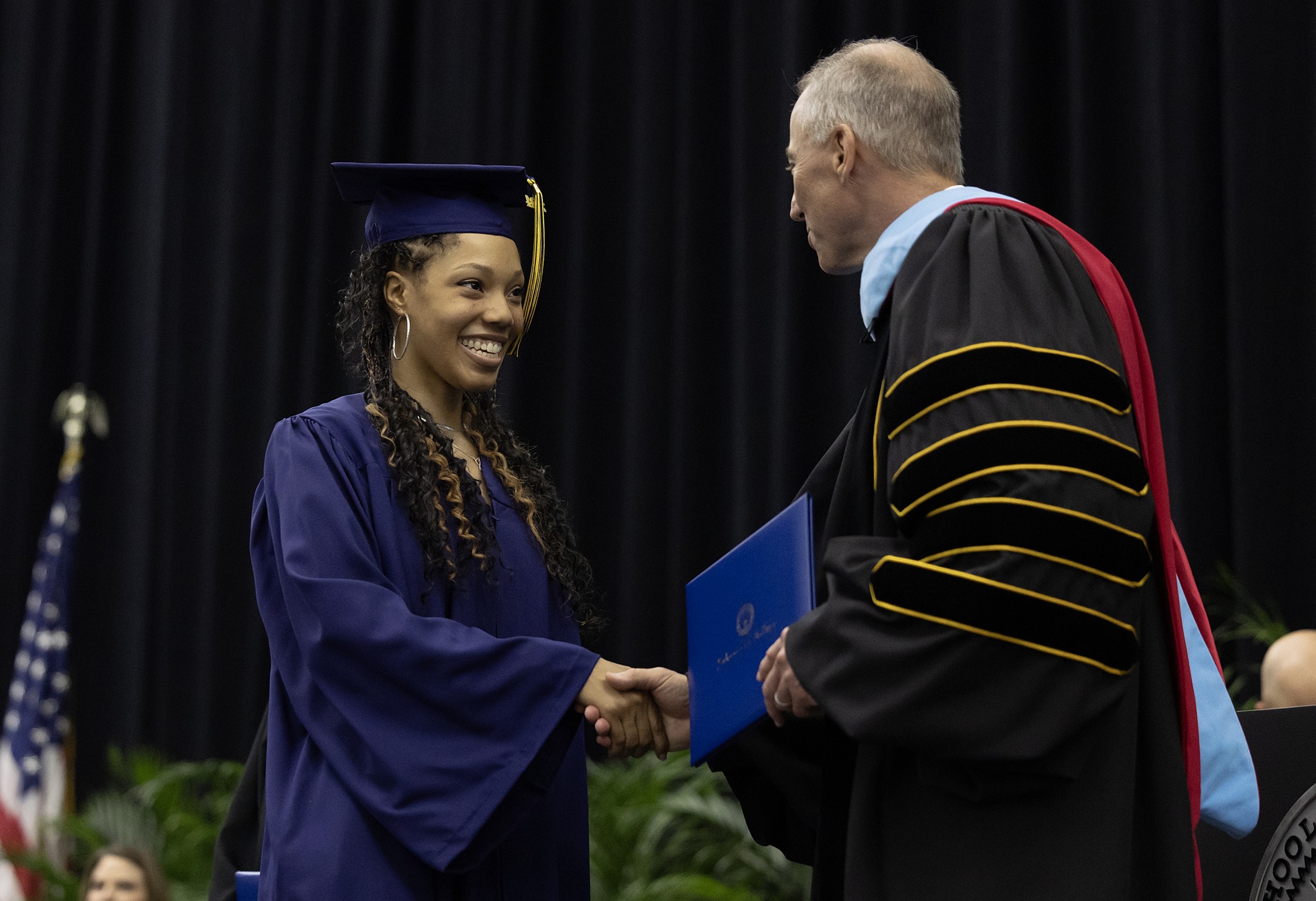 graduate receiving diploma
