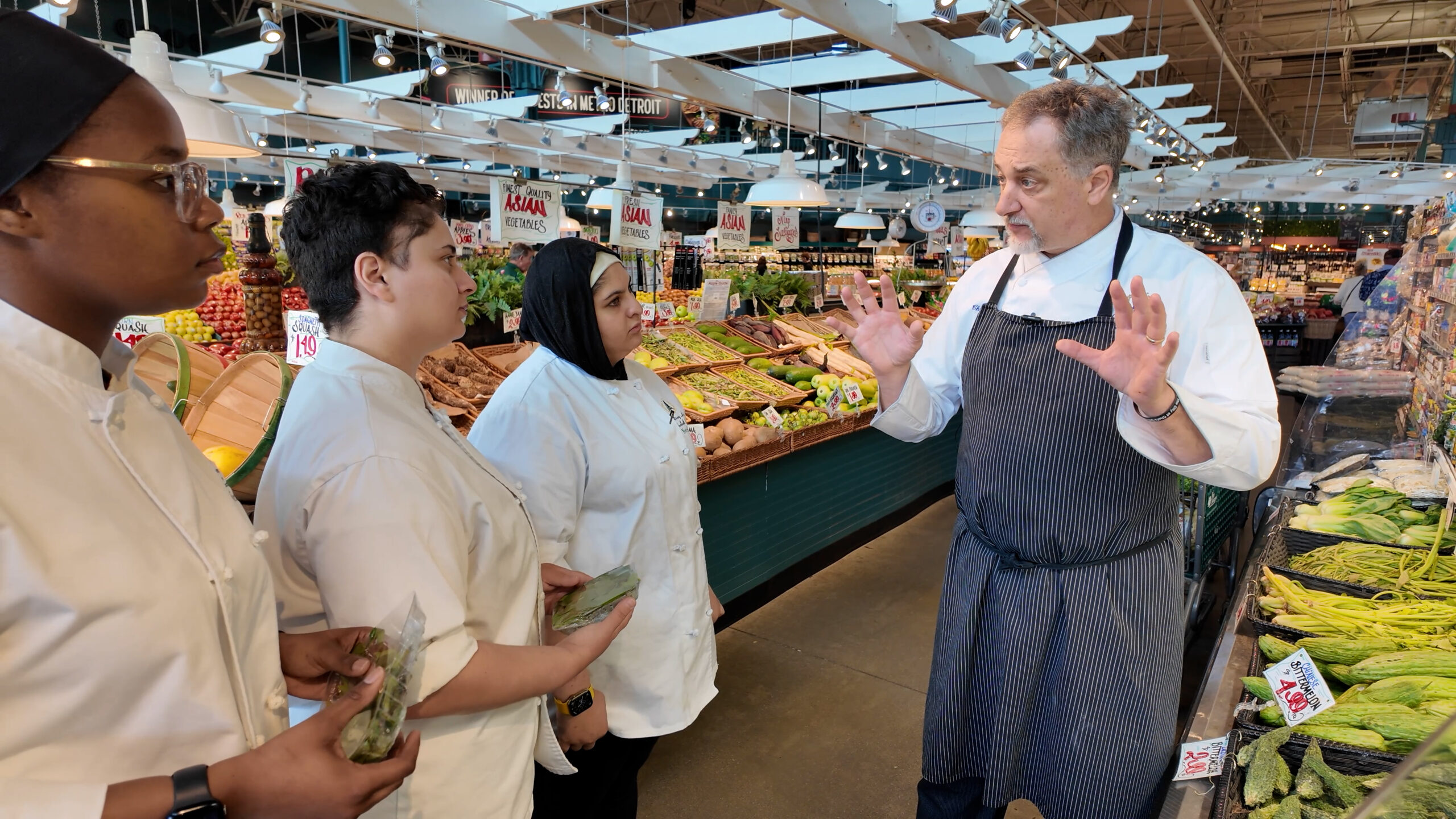Chef Chris Misiak, CEC, speaks to students at one of Nino Salvaggio’s markets.