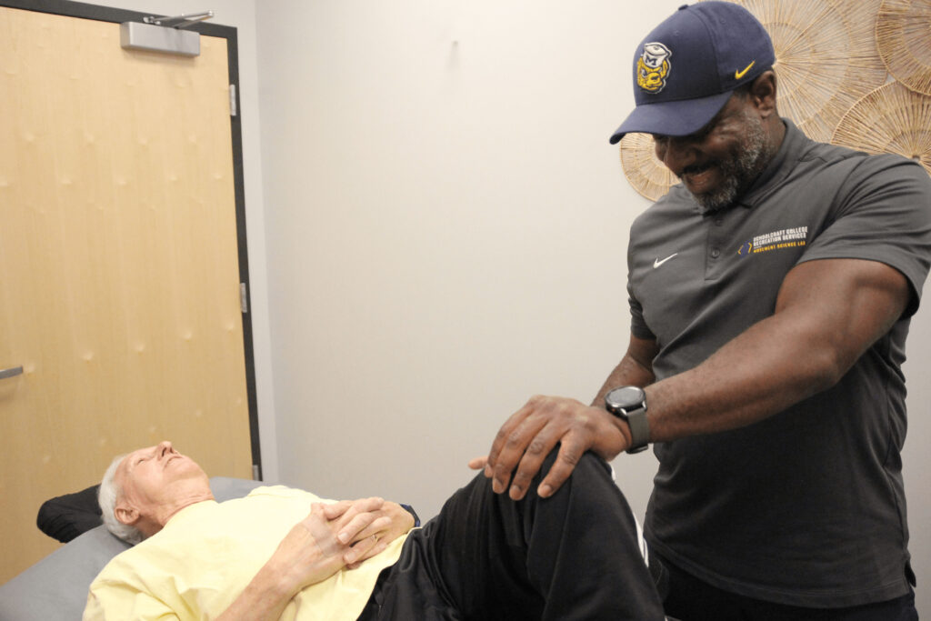 professional looking at patient's knee