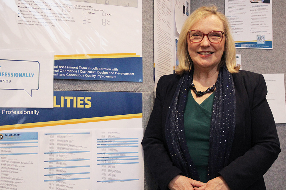 Cynthia Cicchelli next to wall of posters