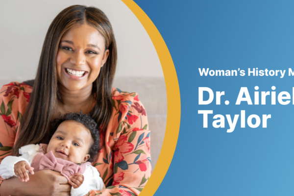 Dr. Airielle Taylor holding her infant