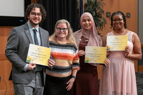 group of students holding awards