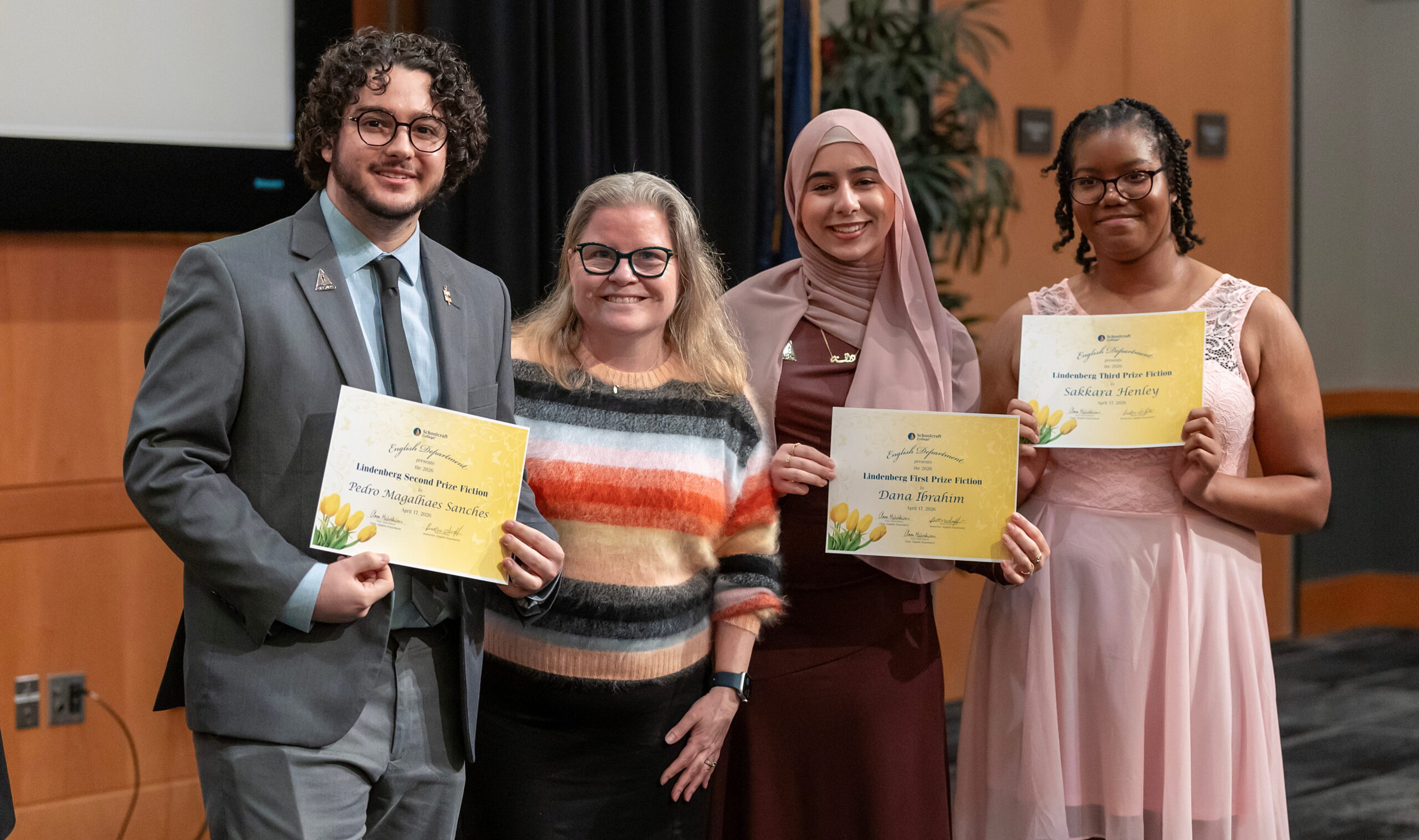 group of students holding awards