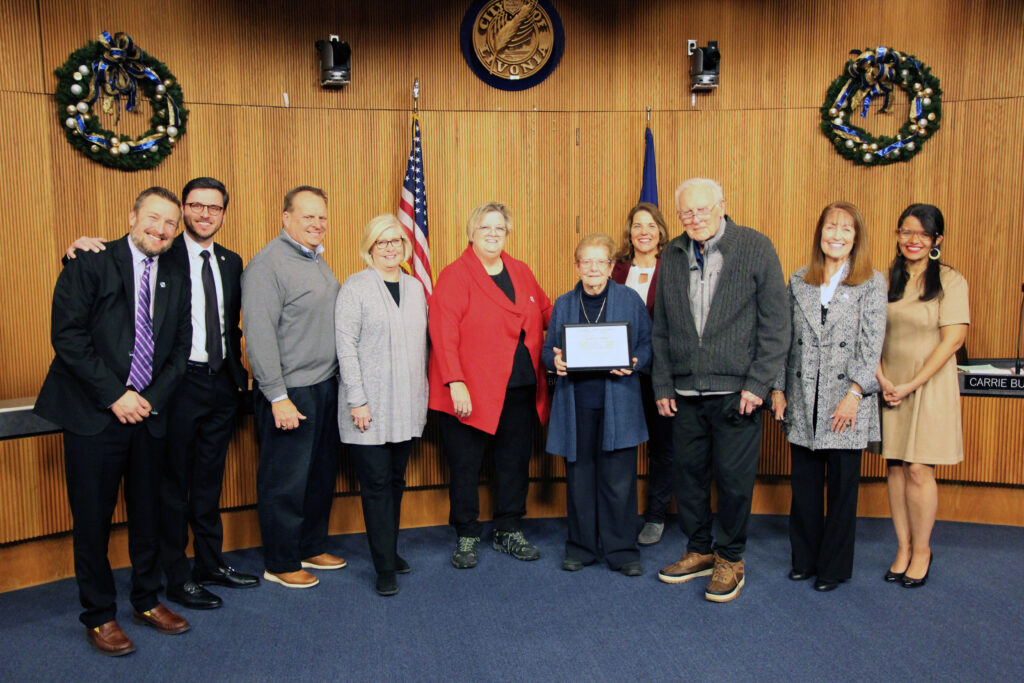 Carol Strom poses with her family and the Livonia City Council