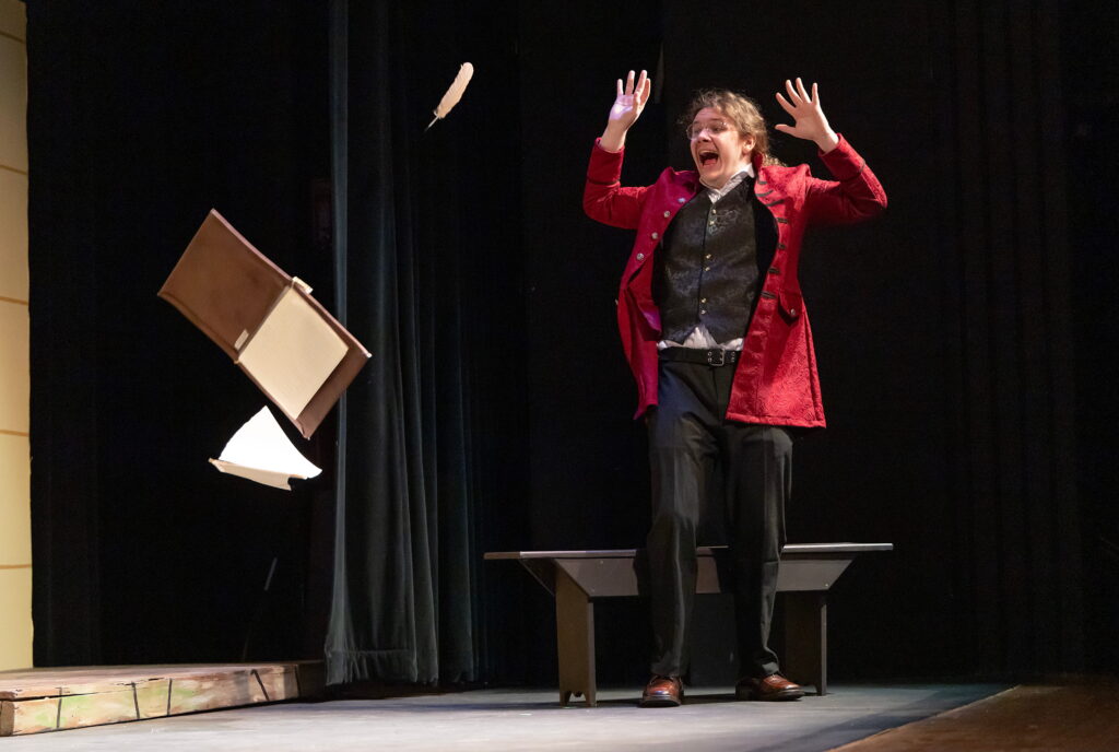 stage actor looking in surprise and fear