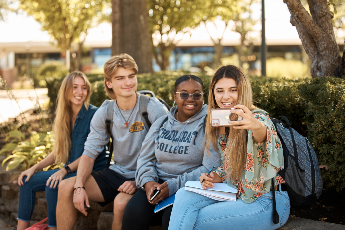 four students taking a selfie