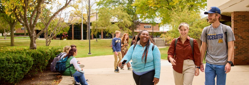 students walking outdoors campus