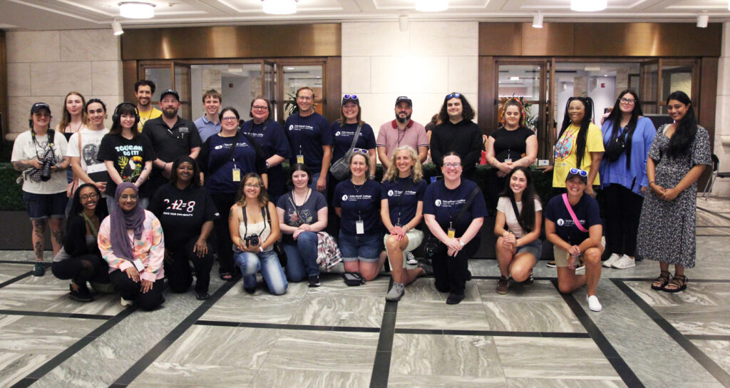 a group of students and staff posing for a picture.