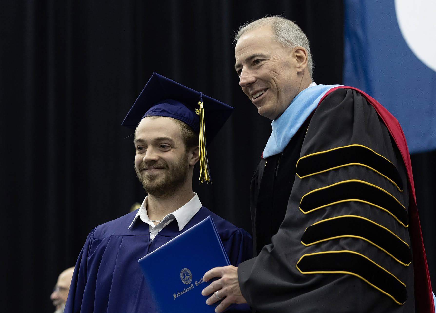 Kaleb Aethyr poses with Schoolcraft College President Dr. Glenn Cerny